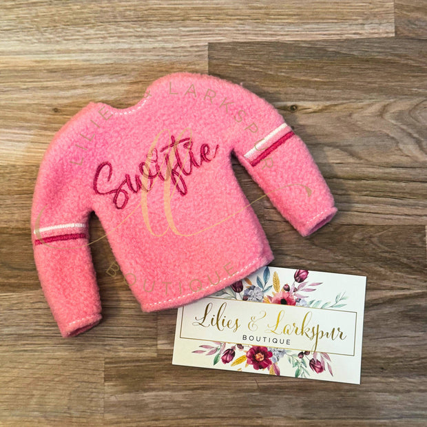 Pink Swiftie Elf Sweater: Sweaters come prepackage in hanging bags