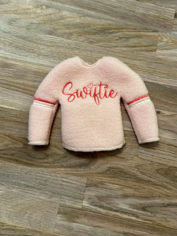 Light pink Swiftie Elf sweater : Sweaters come prepackage in hanging bags